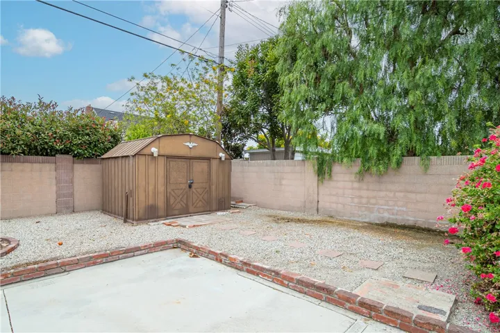 In the backyard are two storage sheds.