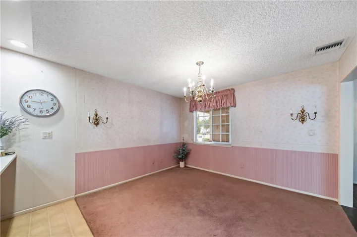 Off the kitchen is a large and open dining area with built-in cabinetry.