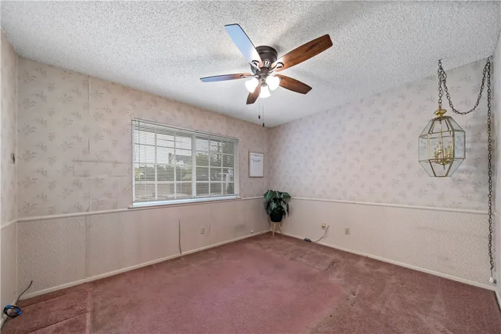 The primary bedroom has mirrored closet doors, and its own private bathroom.