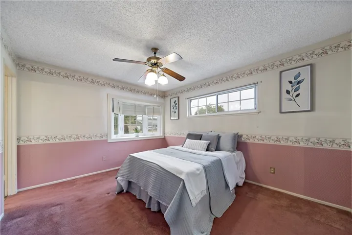 The primary bedroom has a bay window at the front.