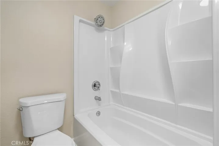 Refreshed shower/tub with plenty of built in shelving!