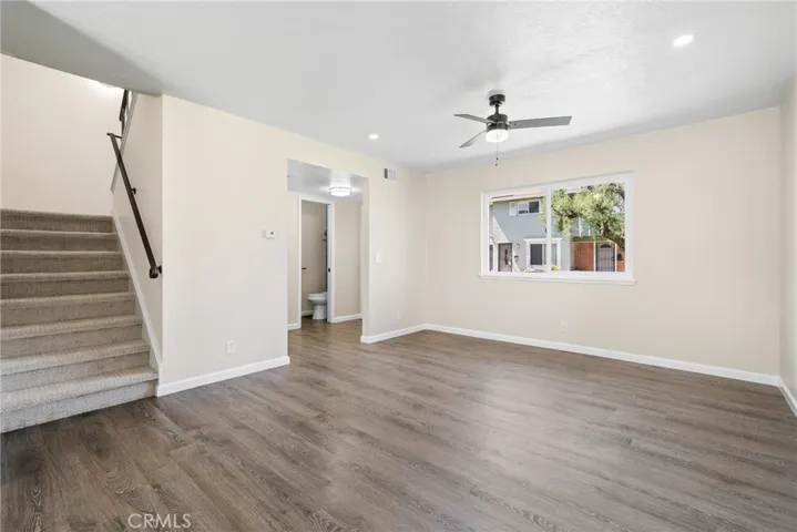 Entering the home, you are greeted by a bright and spacious family room with laminate floors and a new dual paned window!