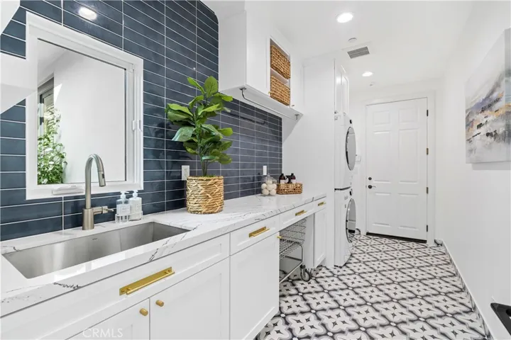 laundry room with custom cabinets