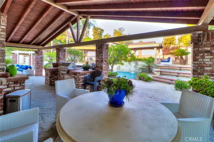 Vaulted Patio Ceiling. Outdoor dining with awesome view in the private back yard oasis.