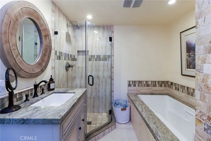 Remodeled primary ensuite, granite counters, soaking tub, seperate tile shower with glass enclosure