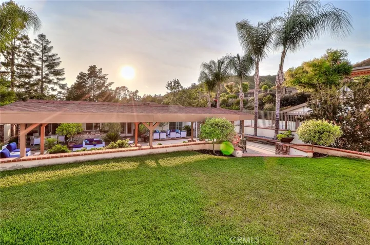 Large grass areas behind pool and spa