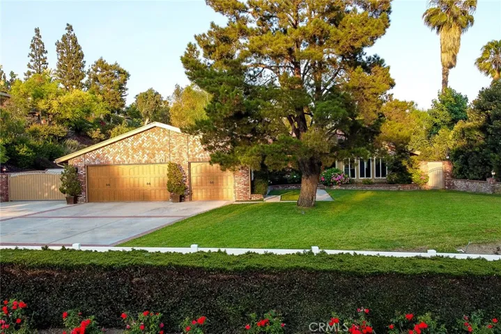 Huge Park like front yard. Upgraded 3 car garage doors, Beautiful curb appeal.