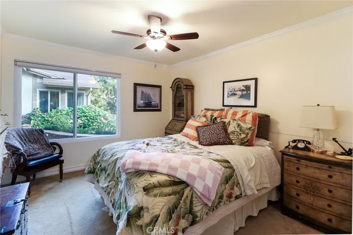 Second bedroom with view of front yard landscape
