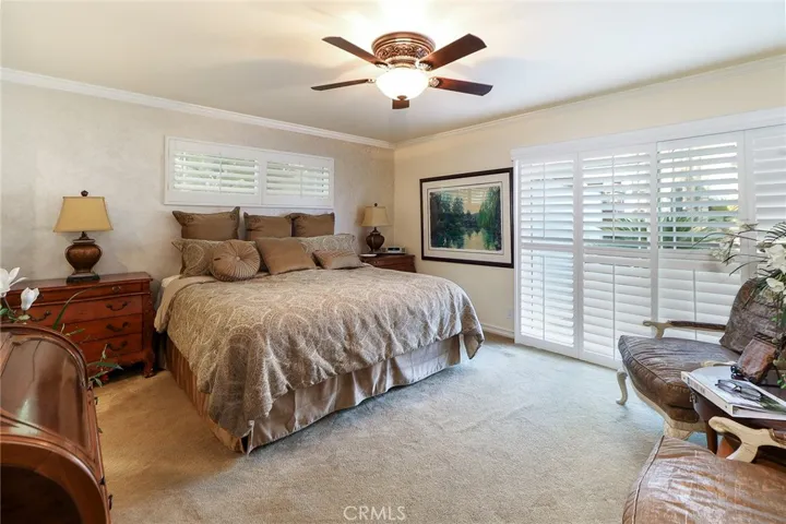 Primary suite with slider to pool and patio