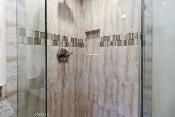 Tile shower with glass enclosure
