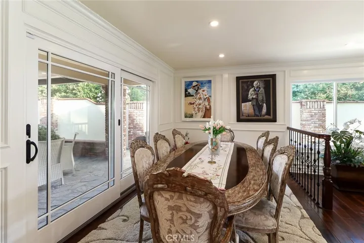 Dining Room with Slider to Patio Outdoor kitchen and dining area.