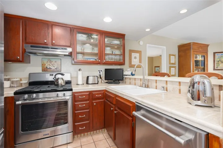 Kitchen opens to the living room and dining room, includes breakfast bar