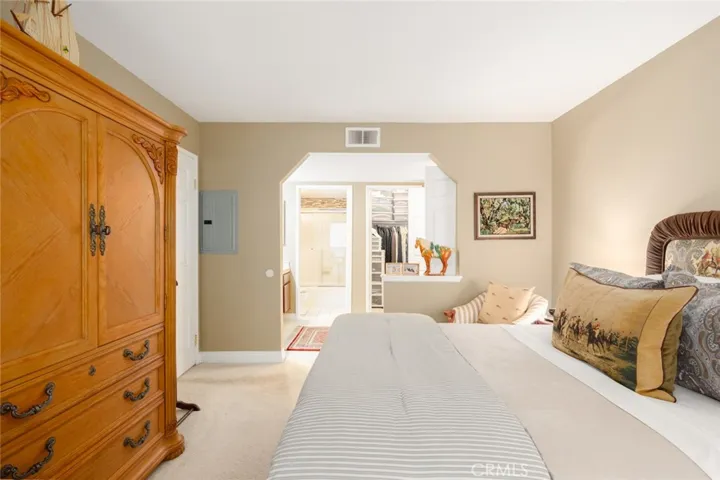 Bedroom with view toward primary bath