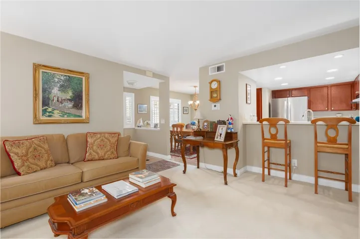 Open floorplan with kitchen, entry and dining room visible