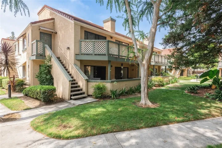 Front exterior, lower level surround by beautiful trees