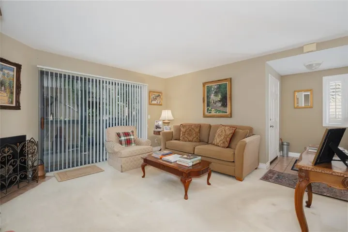 Living room has access to covered patio area.