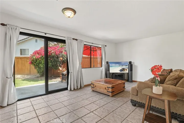 The sliding doors and the windows bring so much light into the heart of house, the family room, and the adjacent kitchen.