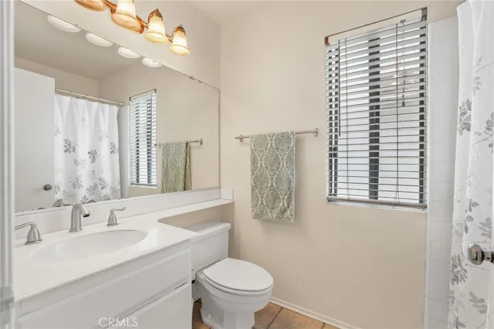 The second bathroom has a shower and tub combo as well.