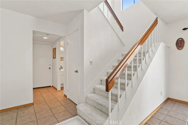 Easy staircases lead to the second floor with the window half way.