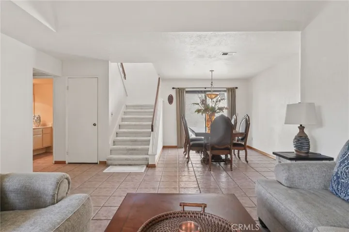 The dining room with the sliding door open to the side yard for extra outdoor space.