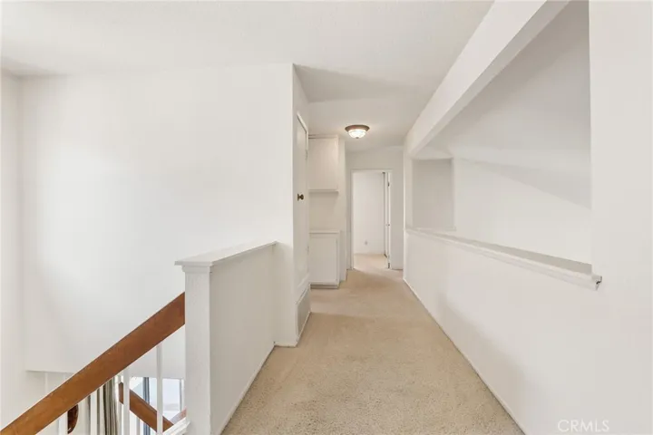 The hallway on the second floor, the two secondary bedrooms are at the end of the hallway.
