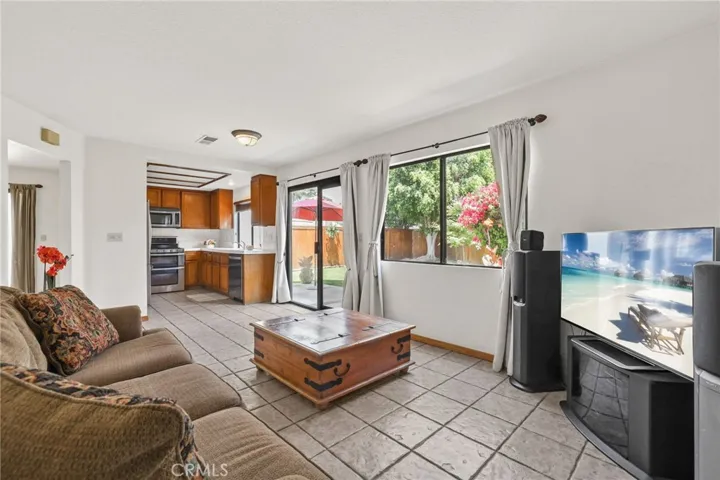 Looking out to the kitchen and the beautiful backyard with mature trees and lush grass.