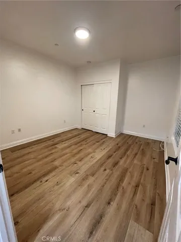 Second bedroom entry view of sliding closet doors