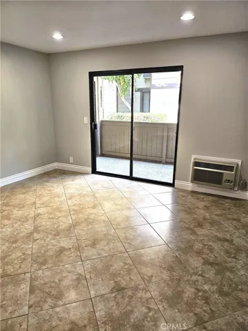 Living area, opening onto private patio by brook.