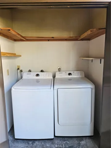 Utility room with washer & dryer,and storage.