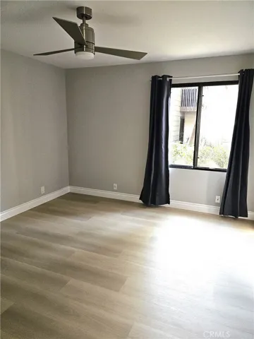 Bedroom #1, with brook outside; ceiling fan and blackout curtains inside.