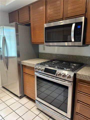 Lease Now - 2 bedroom, 2 baths, 1 car attached garage. Upstairs unit with balcony.  Refrigerator, Washer & Dryer included