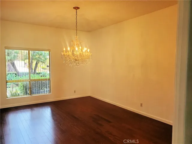Formal dine with high ceilings and a chandelier