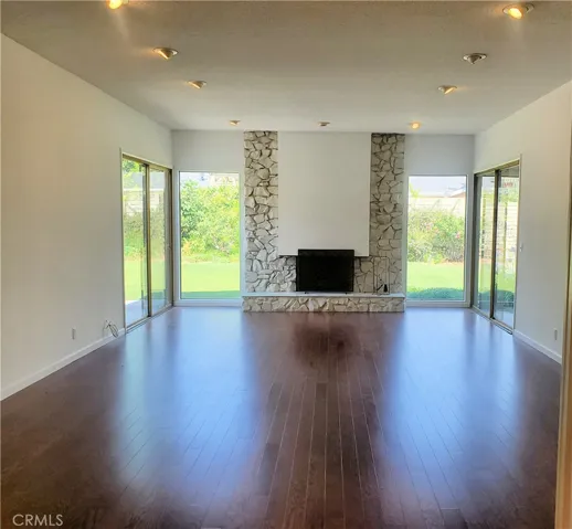 Large living room with high ceilings & 2 sliders to the yard.