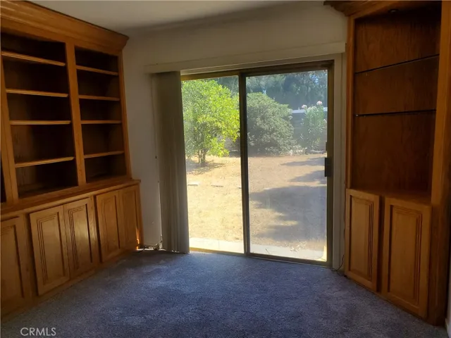 Bedroom also has a built-in wall of shelves & cabinets