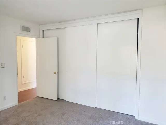Bedroom #1  with triple door closet