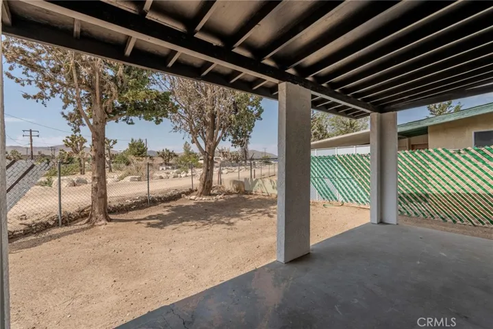 Covered patio in back of the house