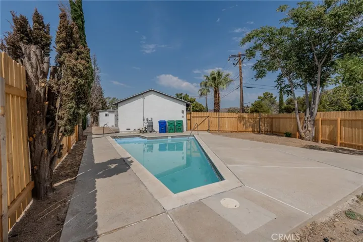 Side yard with in ground pool
