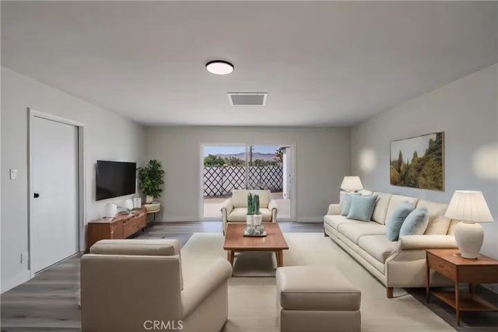 Family room next to the garage (virtually staged)