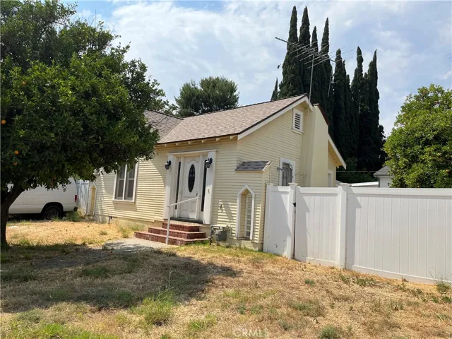 corner lot with multiple orange trees