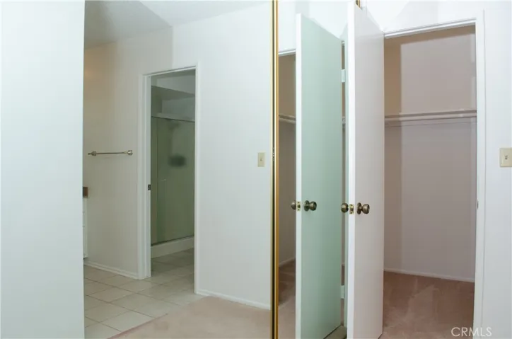 Master Bedroom with Mirrored Wall Closet #2 and Walk in Closet