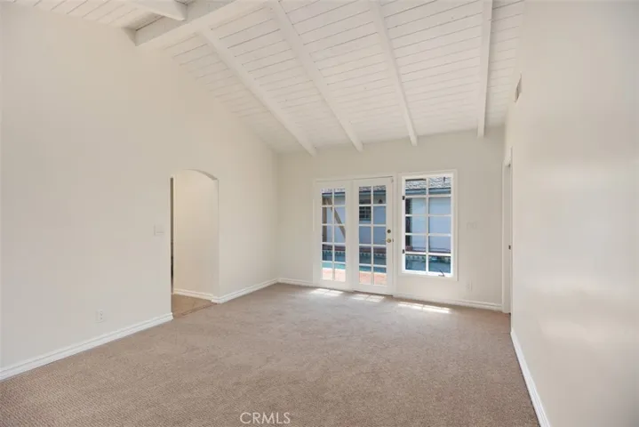 Primary Bedroom with view of the pool