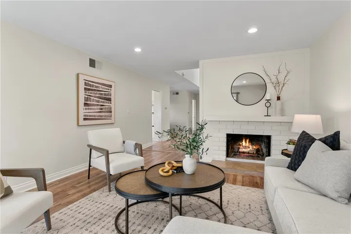 Recessed lighting and laminate floors complete the space.