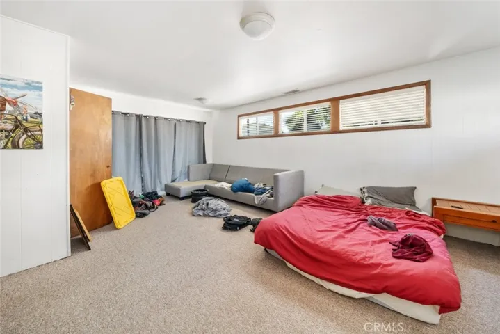 Primary Bedroom with sliding glass door to backyard