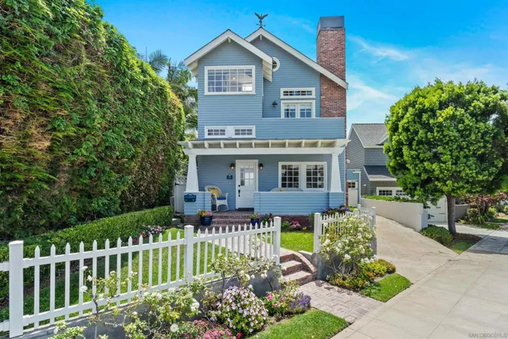 Beautiful award winning garden with partial fencing and inviting brick walkway. Great curb appeal.