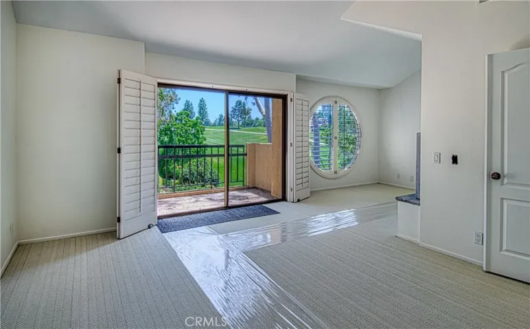 Primary bedroom w/ view balcony