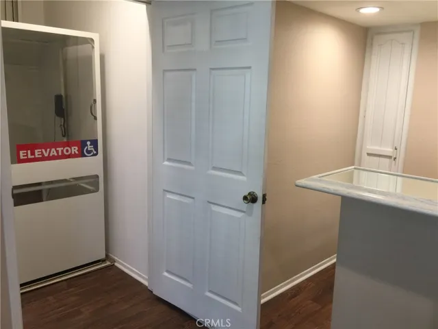 Elevator. Wet-Bar on Right