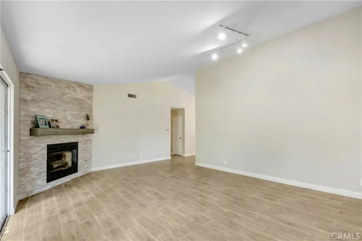 Fresh new wood burning fireplace, and new flooring throughout