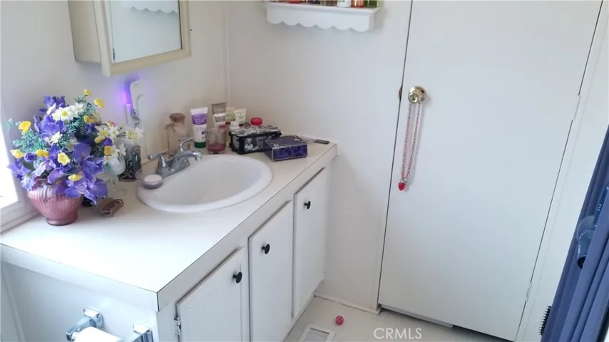 Primary Bathroom with linen closet and bathtub