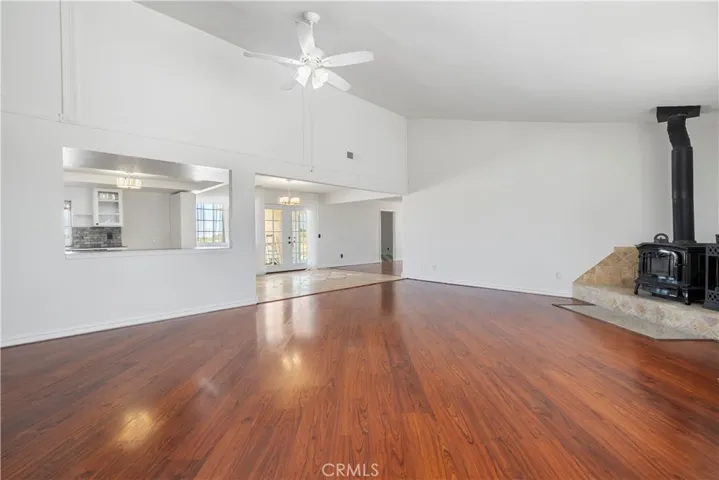 As you enter the home, the foyer is open and you can see into the living room, dining room and kitchen