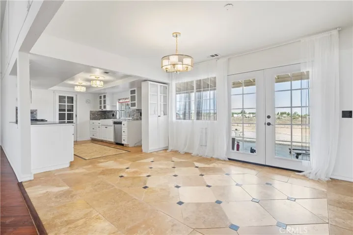This is an easy area to meal prep and dine in. Views to the back of the home with expansive space for outdoor activities.
